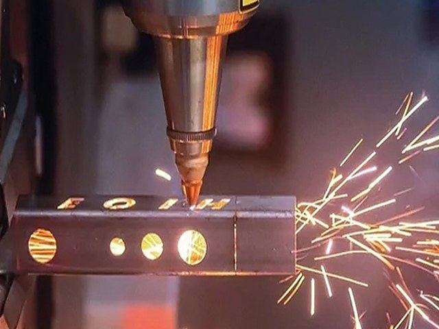 CNC laser cutting a metal profile